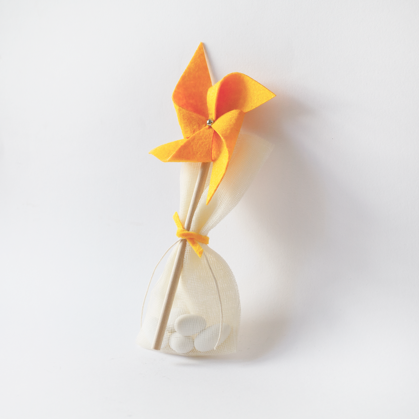 Handmade yellow pinwheel baptism favor